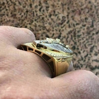 Jesus ring studded with diamond in finger