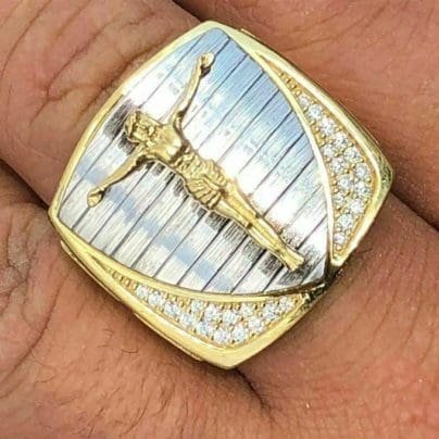 Jesus ring studded with diamond in finger