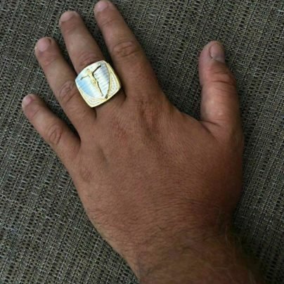 Jesus ring studded with diamond in hand